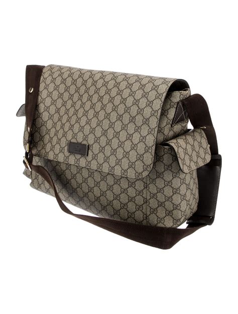 gucci gg supreme wolf print diaper bag brown|pre owned gucci diaper bag.